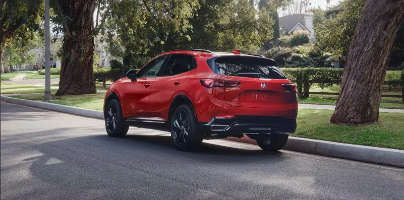A red 2026 Buick Envision parked on the side of the road.